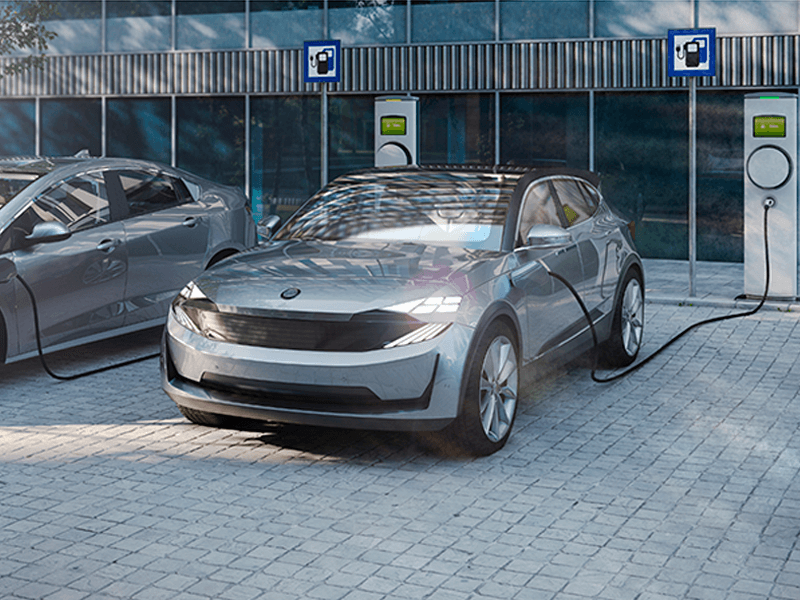 A silver, new EV (electric vehicle) charges at a high-speed charging station