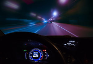 Graphic: The dashboard of a car is illuminated in a car travelling at night at high speed