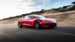 Graphic: A red Tesla Roadster, moving blurry background fast