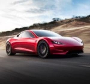 Graphic: A red Tesla Roadster, moving blurry background fast