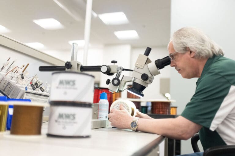 Man looking in microscope