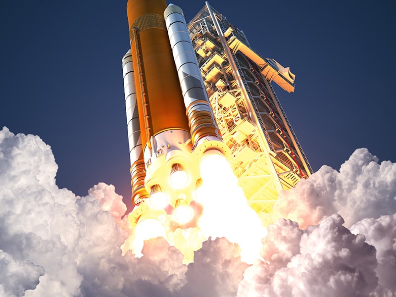 High-tech rocket launch from a space infrastructure facility, powerfully lifting off amidst clouds, showcasing advanced aerospace engineering and satellite launch capabilities.