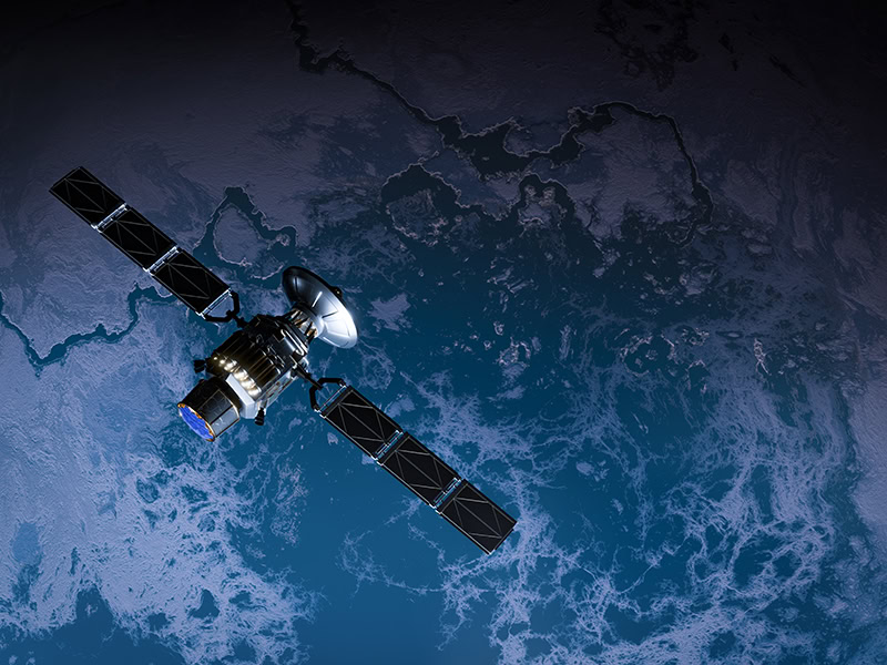 Satellite orbiting Earth with solar panels and communication equipment in space.
